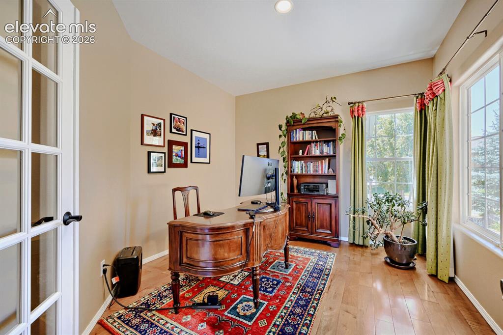 Image 7 of 39: Private, main level, french doors