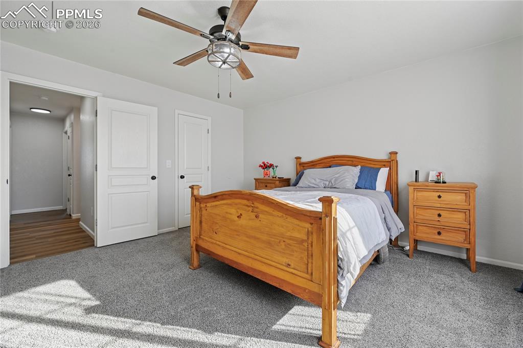 Image 17 of 37: Bedroom with carpet flooring and a ceiling fan
