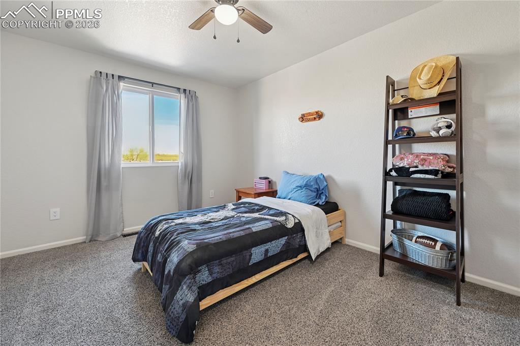 Image 25 of 37: Bedroom with carpet flooring and ceiling fan