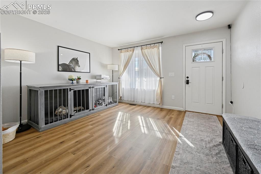 Image 4 of 37: Foyer entrance featuring light wood-style floors and baseboards