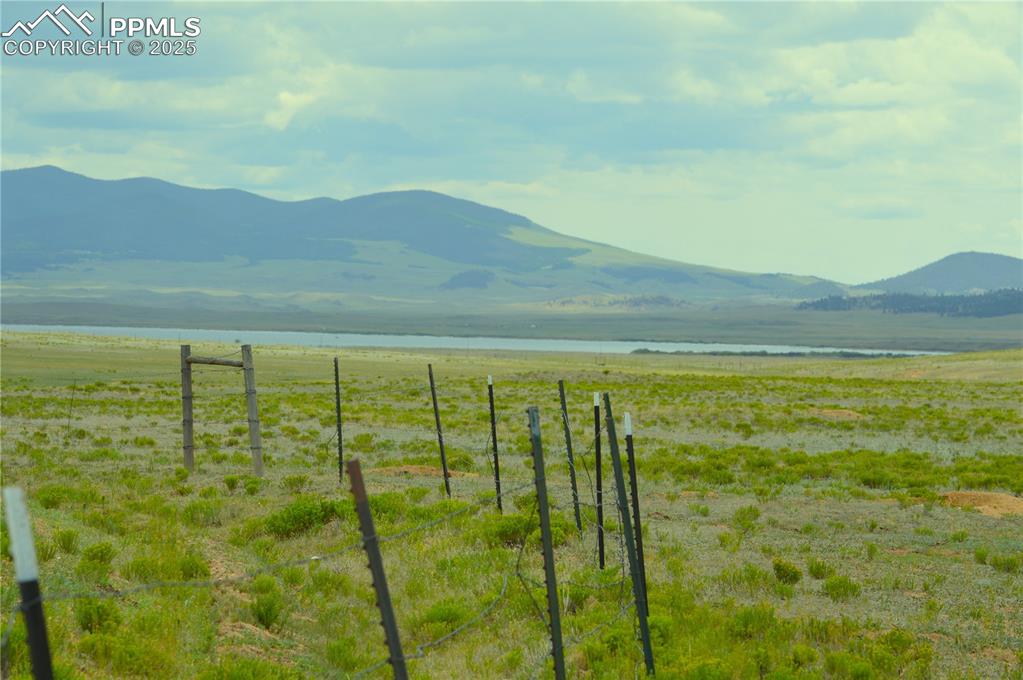 Image 3 of 6: View of mountain backdrop with rural landscape