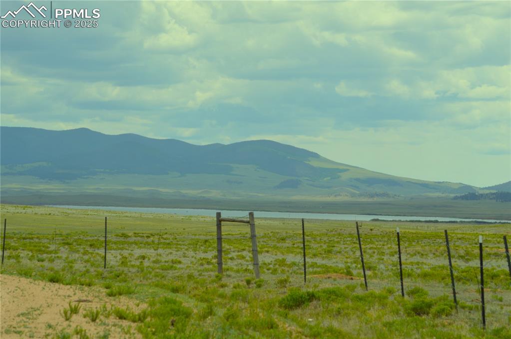 Image 5 of 6: View of mountain backdrop featuring rural landscape