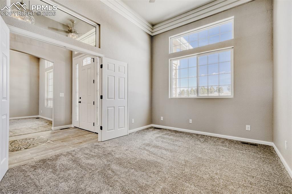 Image 16 of 47: Secondary Bedroom #1 or Office off the front door with full bath.