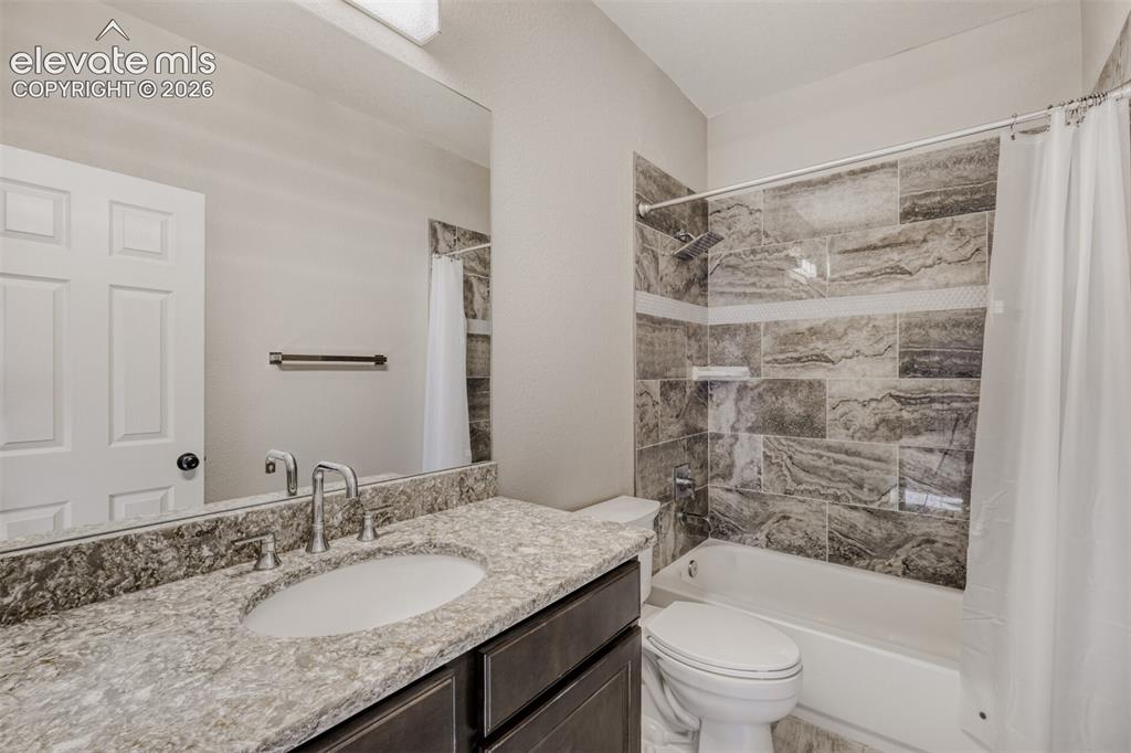 Image 17 of 50: Full bath secondary bathroom