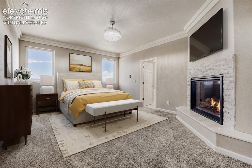 Image 18 of 50: Virtually staged primary Bedroom with fireplace, massive closet, lux 5-piec