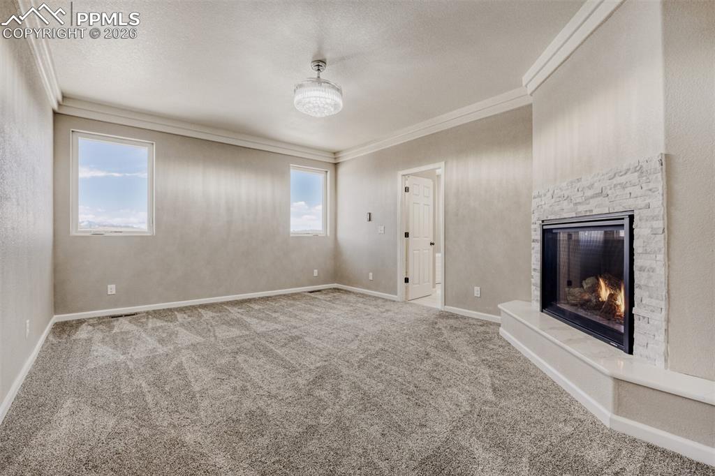 Image 19 of 47: Primary Bedroom with fireplace, massive closet, lux 5-piece bath