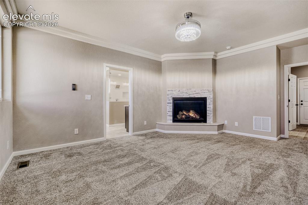Image 21 of 50: Primary Bedroom with fireplace, massive closet, lux 5-piece bath