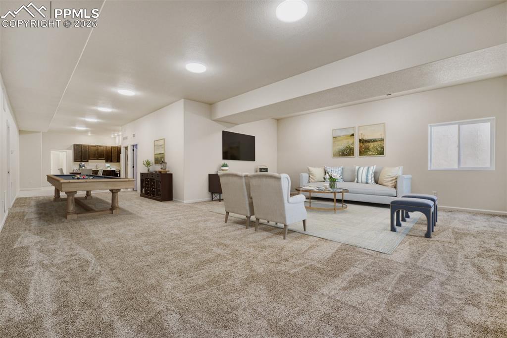 Image 31 of 47: Virtually stage d basement family/game room with kitchenette and second lau