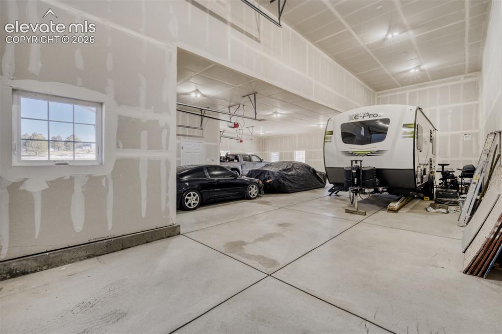 Image 38 of 50: Huge garage with RV parking
