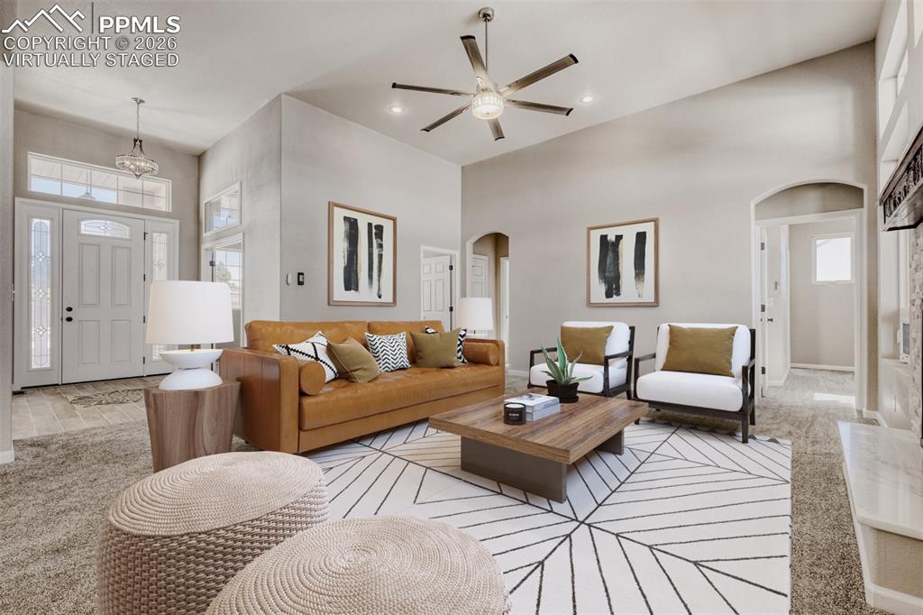 Image 5 of 47: Virtually staged Living Room with open concept and covered deck.