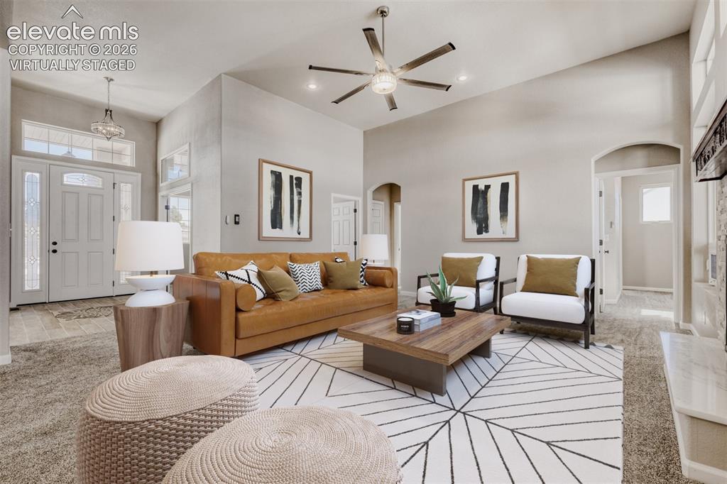 Image 5 of 50: Virtually staged Living Room with open concept and covered deck.