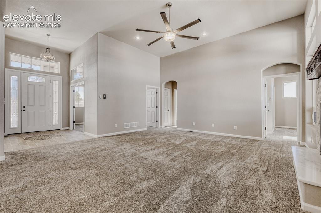 Image 6 of 50: Living Room with open concept and covered deck.