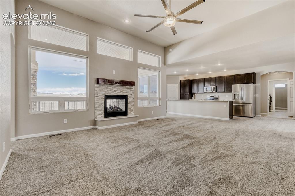 Image 8 of 50: Living Room with open concept and covered deck.