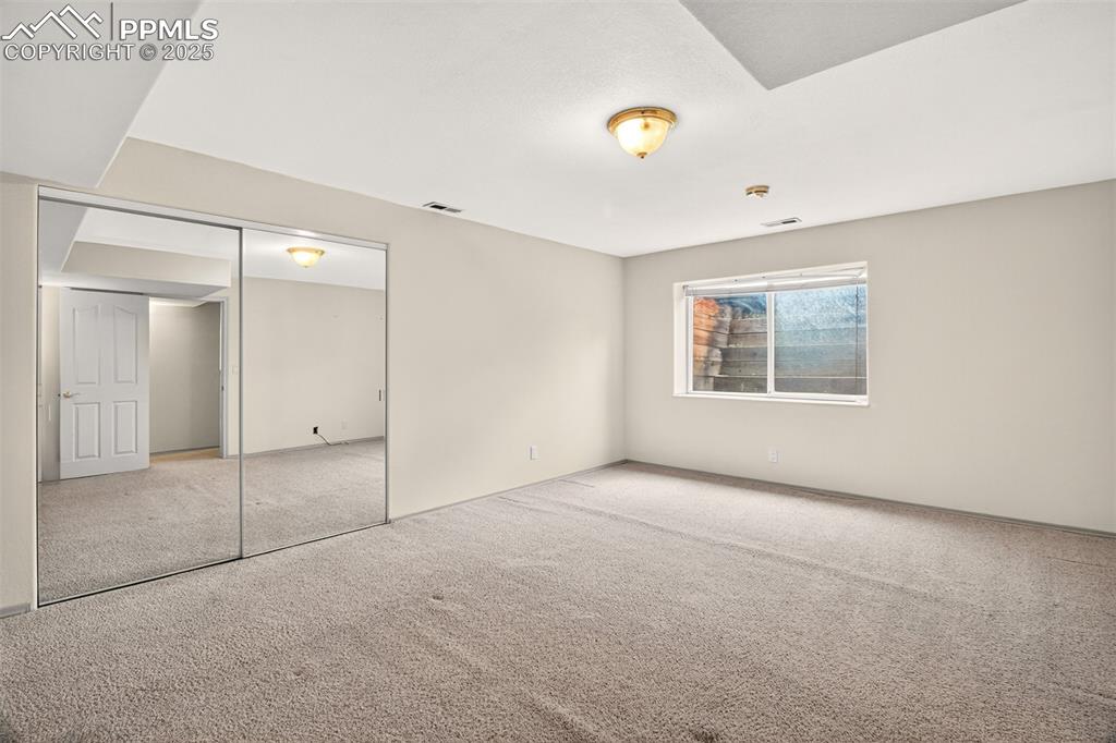 Image 28 of 35: Downstairs Bedroom