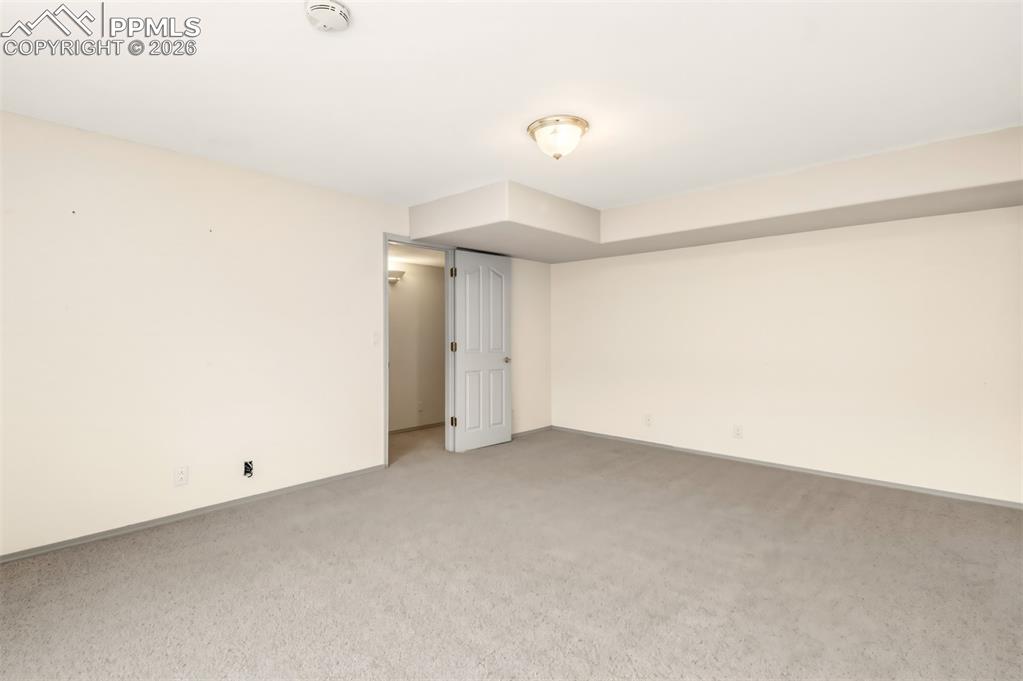 Image 35 of 35: Unfurnished bedroom featuring carpet floors and baseboards
