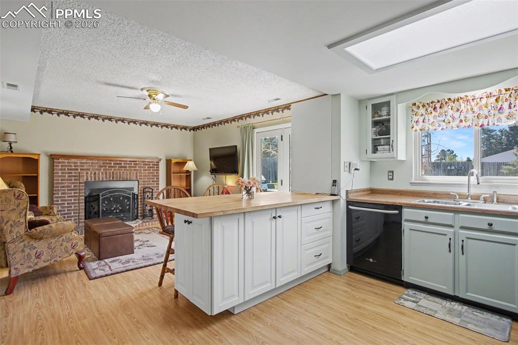 Image 12 of 30: Open to Family Room w/Walk Out!