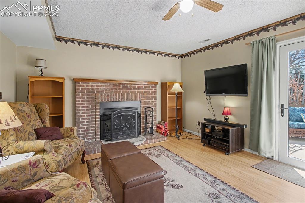 Image 14 of 30: Cozy Family Room Walks Out to Backyard/Patio!