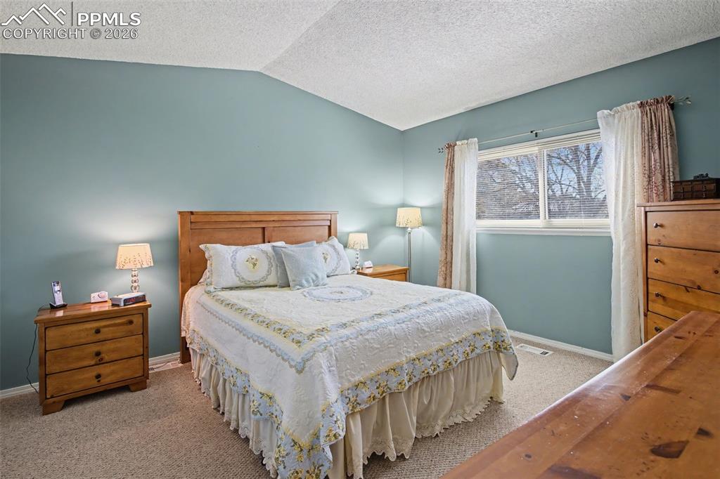 Image 17 of 30: Primary Bedroom w/Vaulted Ceiling!
