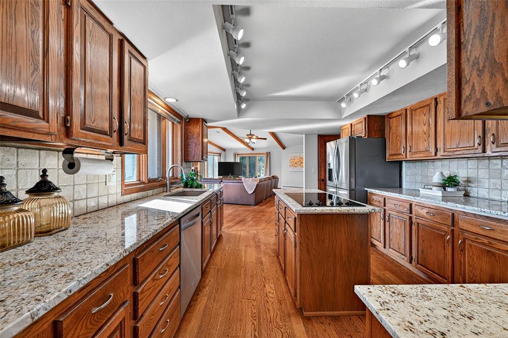 Image 16 of 48: Updated kitchen opens to the large family room!