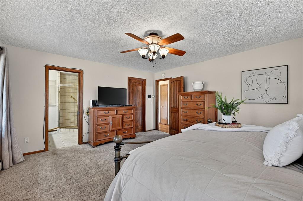 Image 26 of 48: Another view of the master bedroom showing the master bath and walkin close