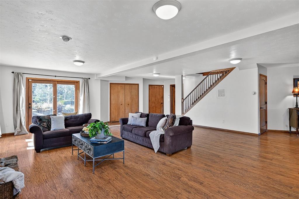 Image 35 of 48: Plank flooring in the huge walkout basement!  All windows are above ground!