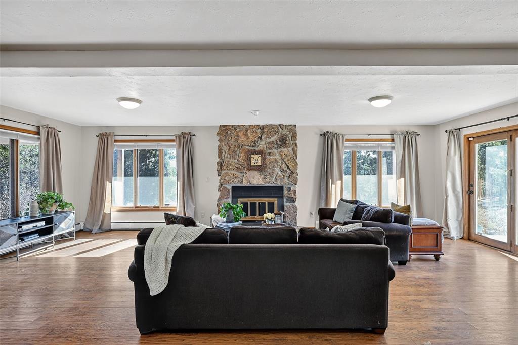 Image 38 of 48: Fun entertaining in your large basement with a cozy fireplace and many wind