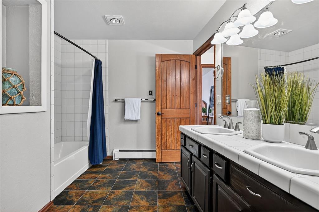 Image 44 of 48: Large basement bath with two more sinks and extra counter space!