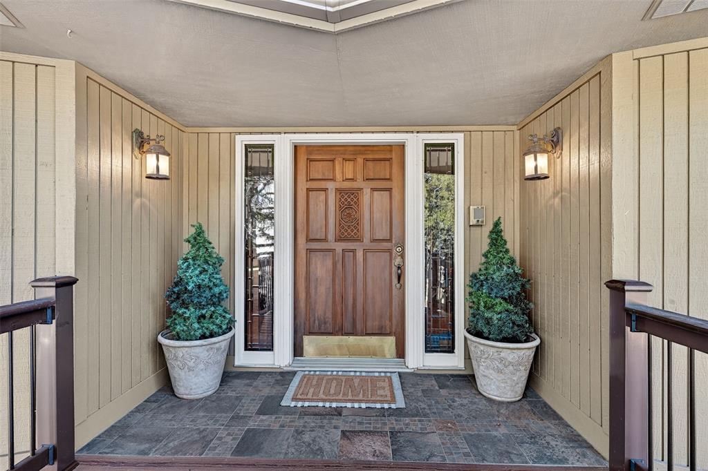 Image 8 of 48: Welcoming covered entry!