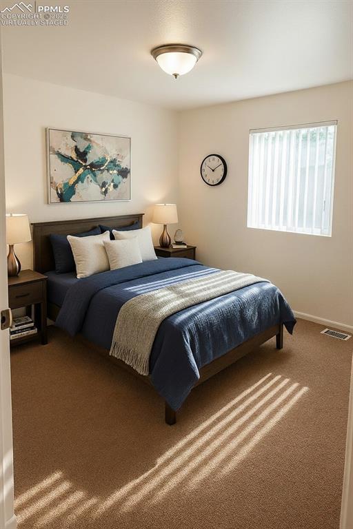 Image 16 of 34: Carpeted bedroom featuring baseboards. virtually staged
