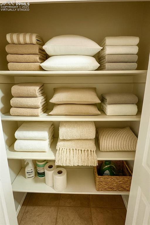 Image 21 of 34: Hall Linen Closet. virtually staged