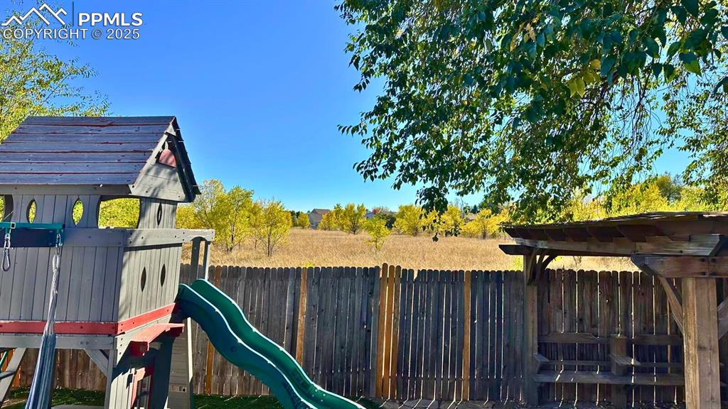 Image 29 of 34: View of playground and open space to the back