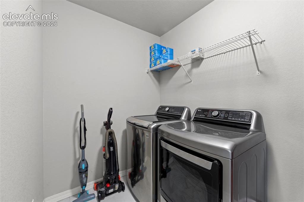 Image 25 of 41: Laundry area featuring a built-in wire shelf