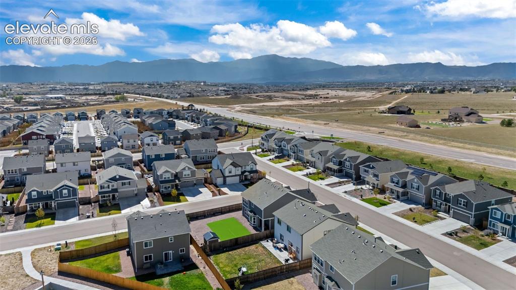 Image 34 of 41: Residential community featuring a variety of home styles, paved streets, an