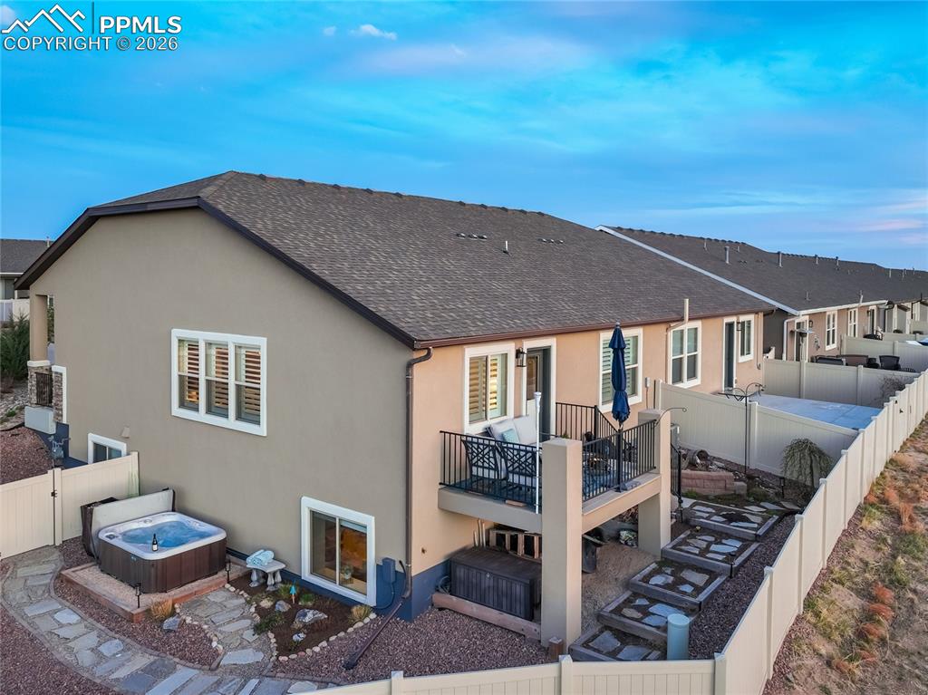 Image 11 of 45: A rare end-of-row corner setting reveals an extended side yard, providing e