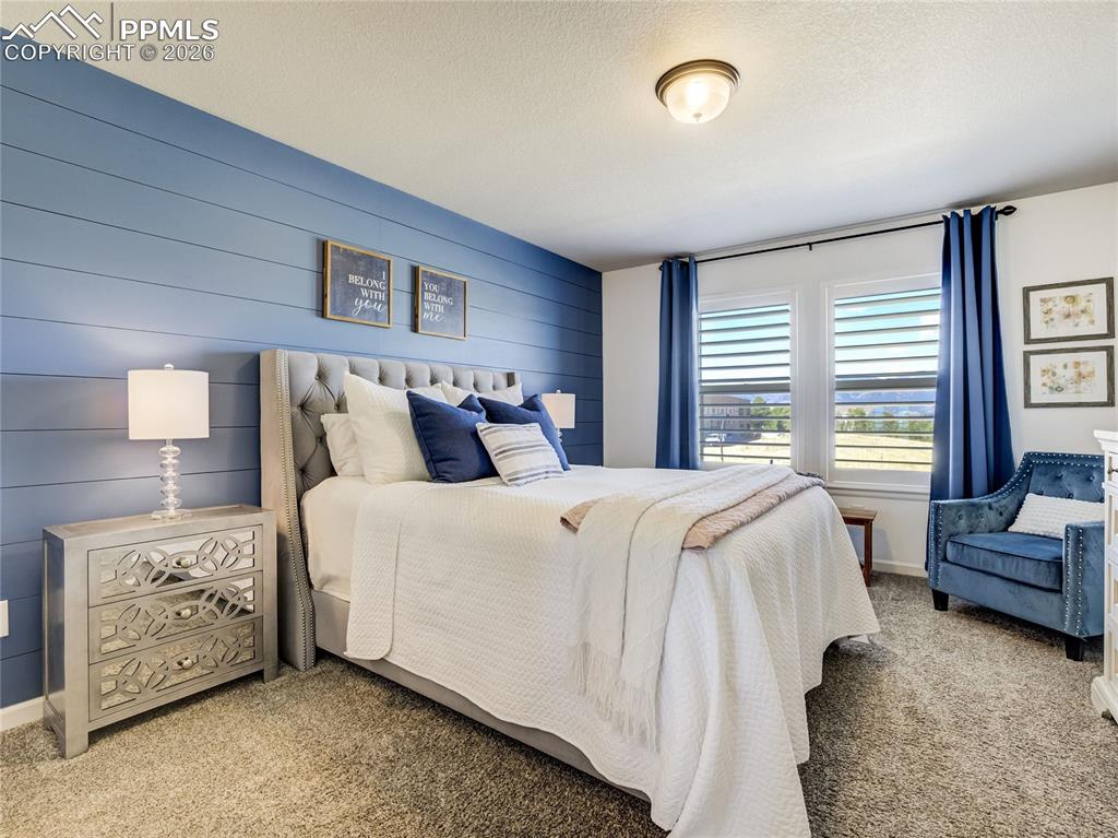 Image 9 of 45: A serene primary suite, where soft lighting, calming tones, and privacy all