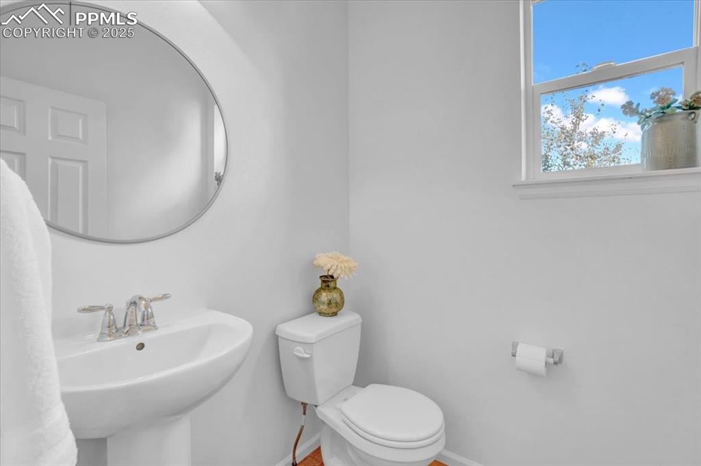 Image 18 of 36: Main floor half bath