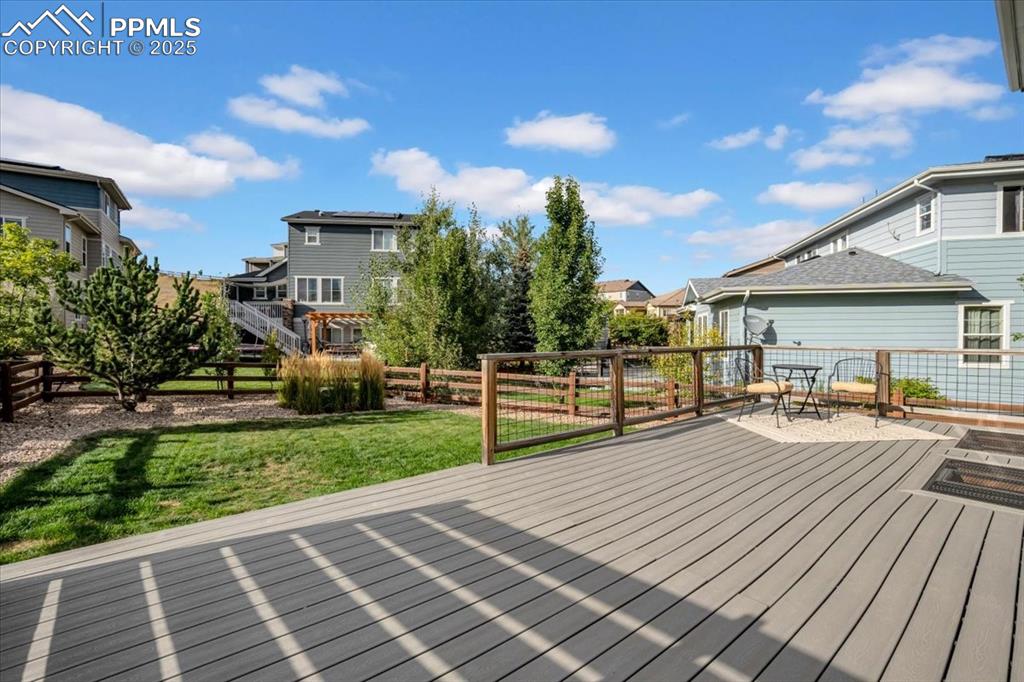 Image 31 of 36: View of backyard from deck