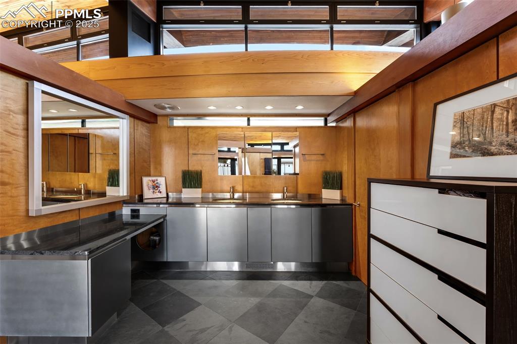 Image 17 of 39: Welcome area featuring recessed lighting and wood walls