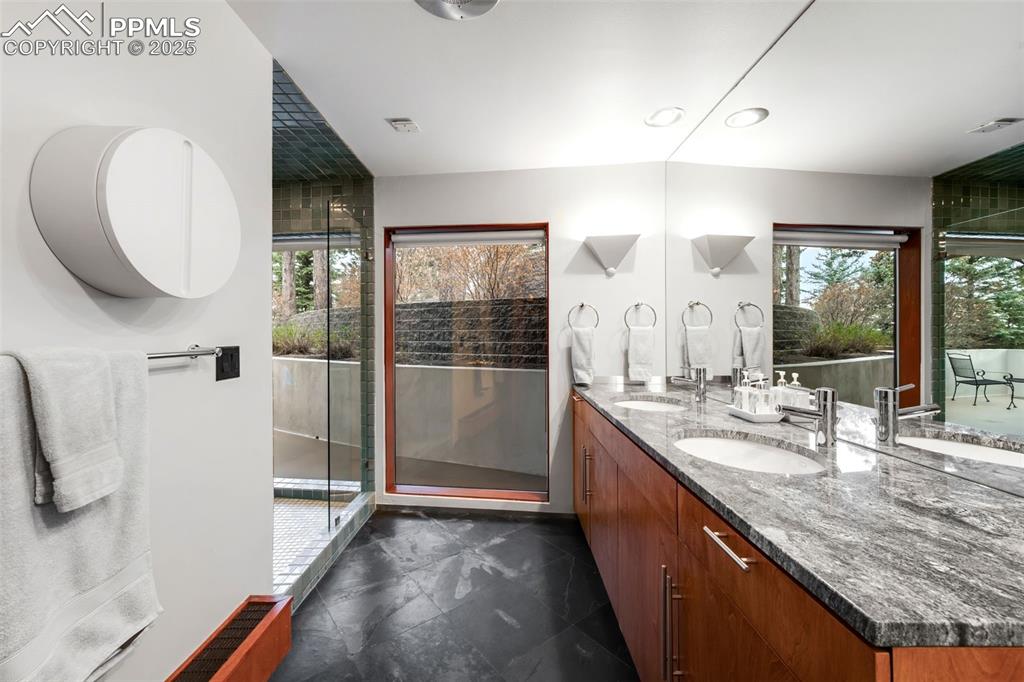 Image 29 of 39: Bathroom featuring double vanity, plenty of natural light, recessed lightin