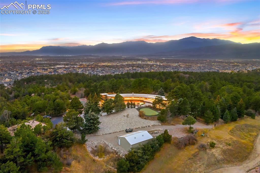 Image 39 of 39: Aerial view at dusk of a mountain view and a forest view