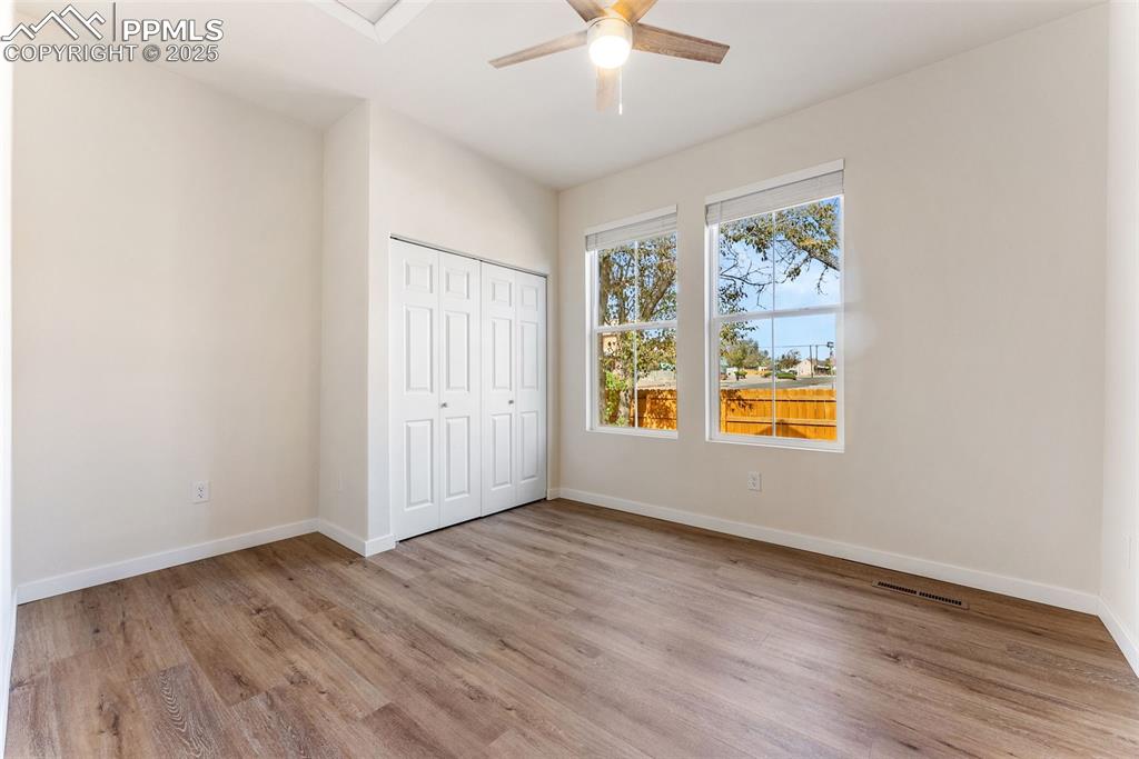 Image 13 of 42: The primary bedroom is a good size and each bedroom comes with ceiling fans
