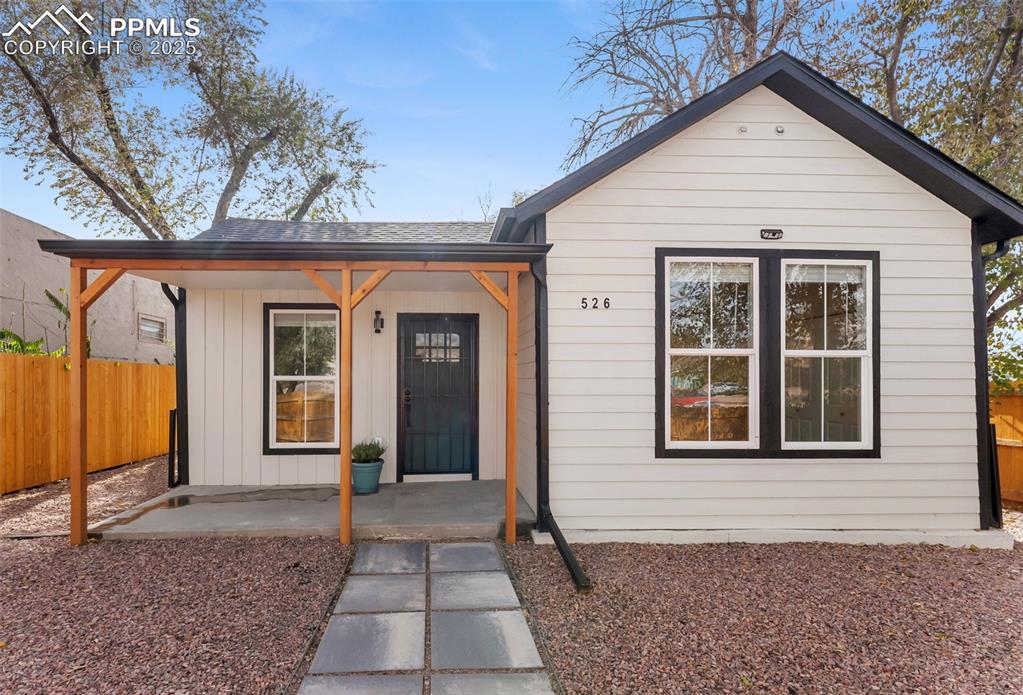 Image 2 of 42: New roof, siding and covered patio