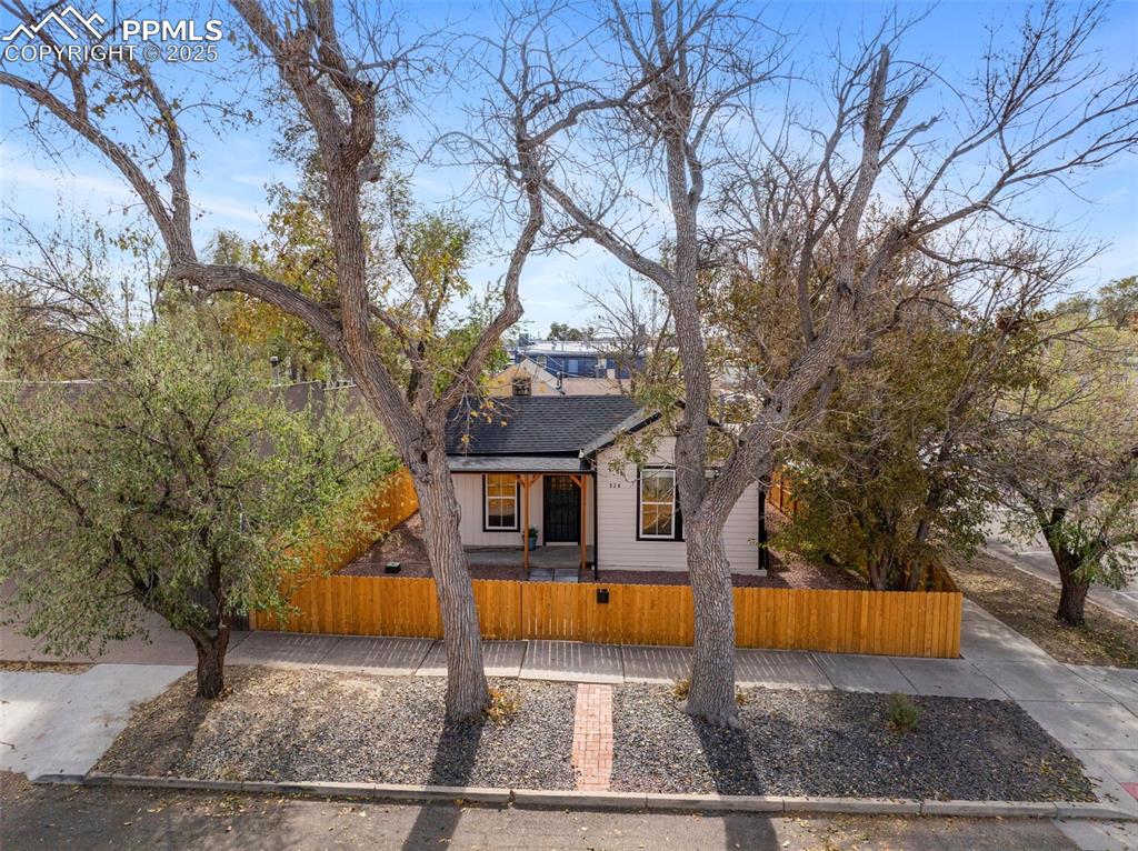Image 27 of 42: Corner lot with many mature trees