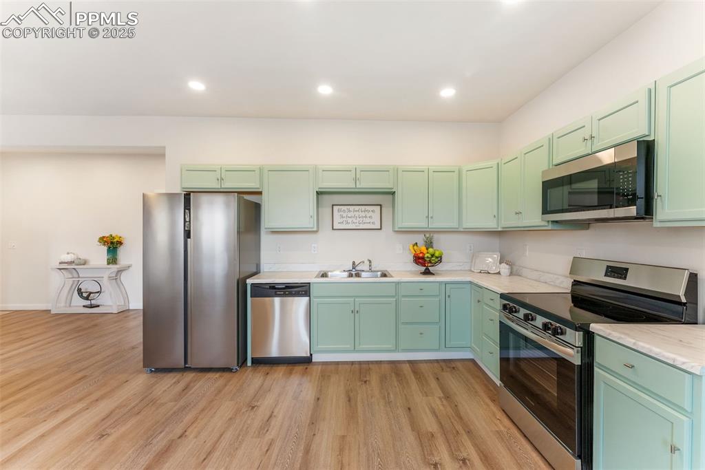 Image 9 of 42: A great amount of cabinet storage for a corner kitchen setup