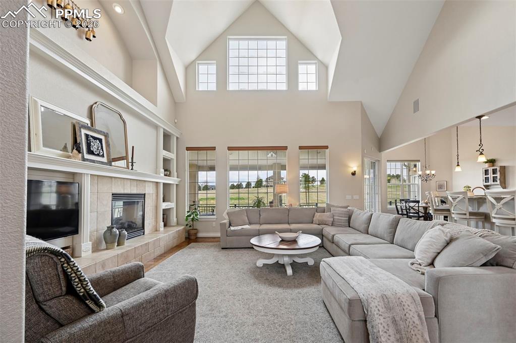 Image 4 of 50: Beautiful soaring ceilings in living room