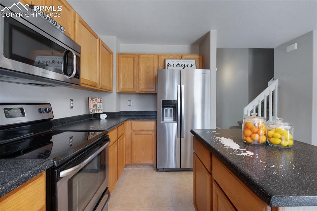 Image 11 of 37: Stainless steel appliances and sink
