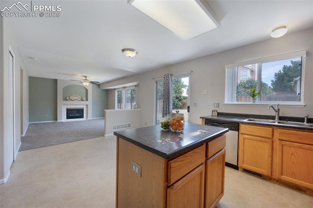 Image 14 of 37: Kitchen, dining area, and family room