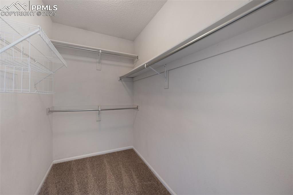 Image 20 of 37: Master bedroom walk-in closet
