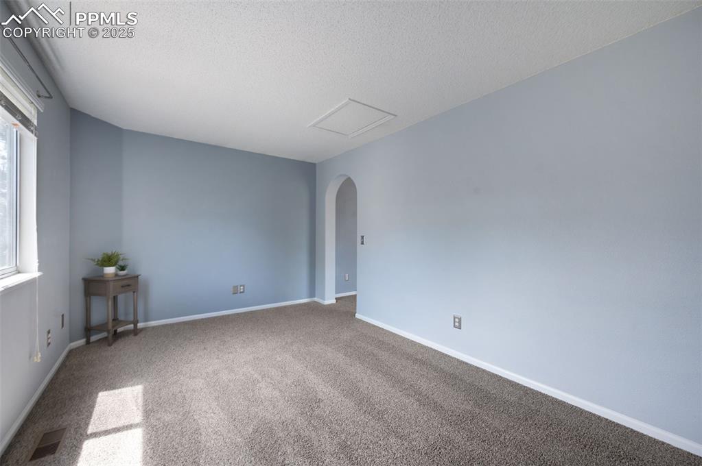 Image 22 of 37: Bonus room off the primary bedroom, new carpet, new trim paint