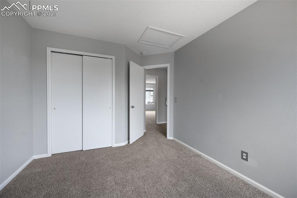 Image 26 of 37: Bedroom #2, new carpet, new trim paint, view of Pikes Peak
